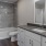 a bathroom with a tub sink and toilet