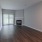a room with a fireplace and a wood floor